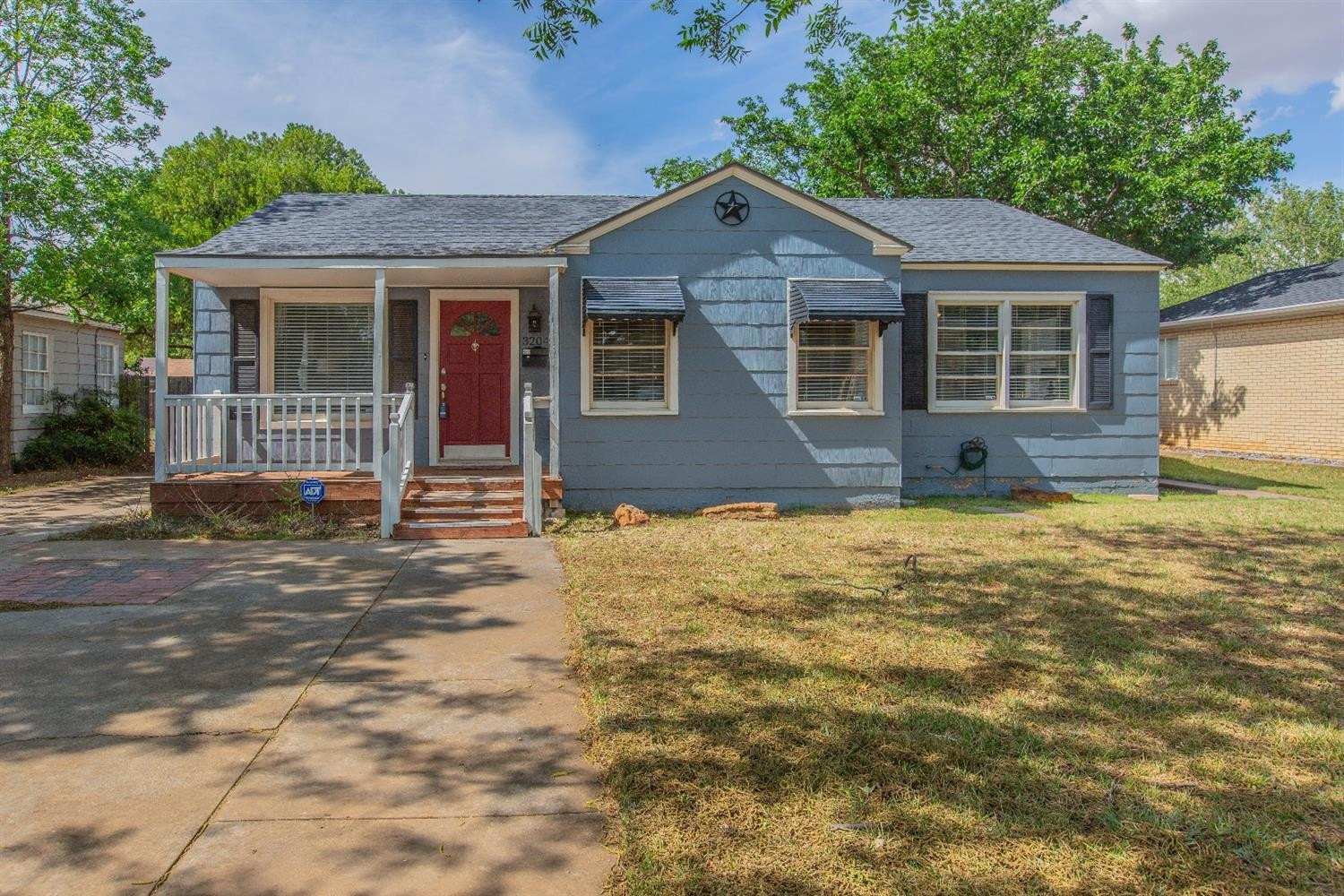 3204 26th Street Lubbock, TX 79410 - Photo 1 of 10 a front view of a house with a yard