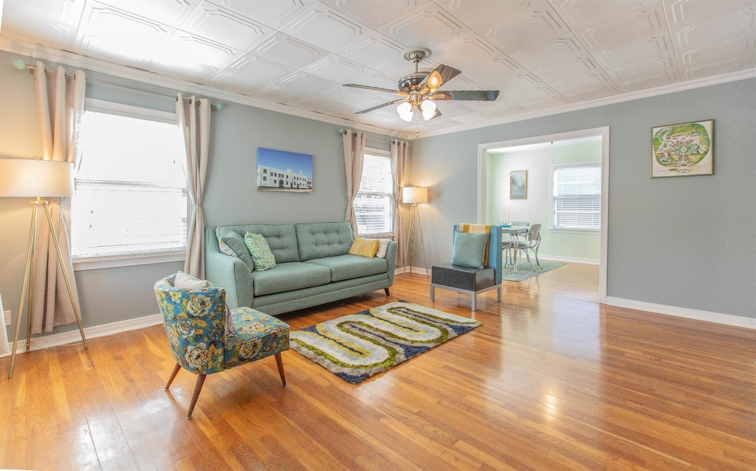 3204 26th Street Lubbock, TX 79410 - Photo 2 of 10 a living room with furniture and a wooden floor