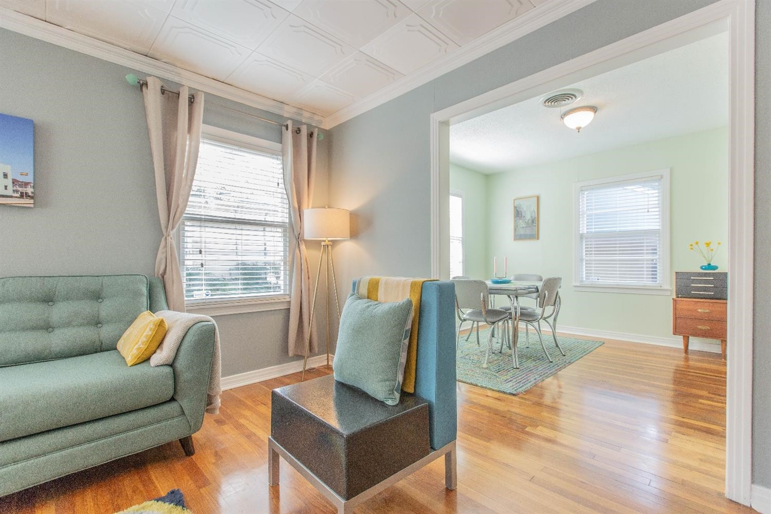 3204 26th Street Lubbock, TX 79410 - Photo 5 of 10 a living room with furniture and wooden floor