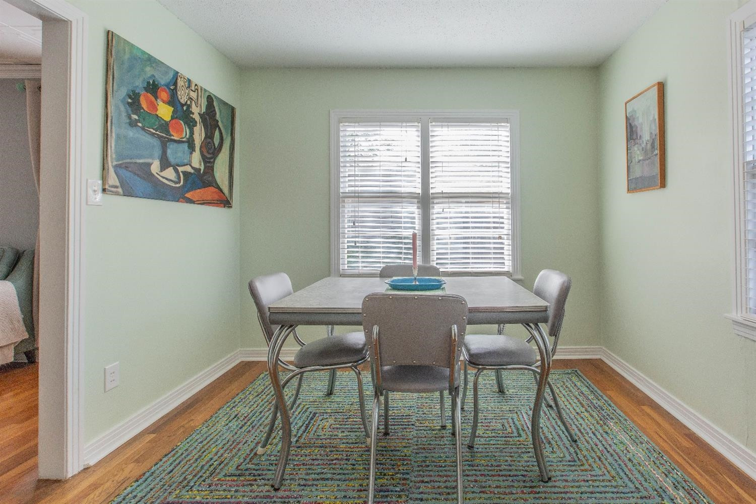 3204 26th Street Lubbock, TX 79410 - Photo 9 of 10 a view of a dining room with furniture a rug and wooden floor
