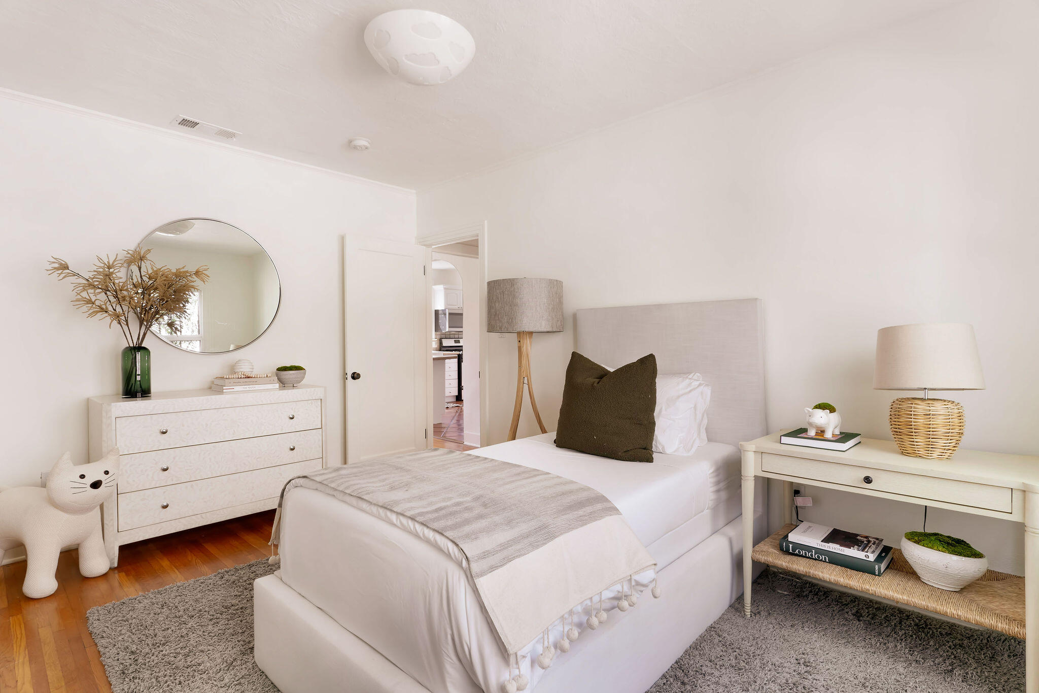 1317 Keniston Avenue Los Angeles, CA 90019 - Photo 23 of 57 a bedroom with a bed and a dresser