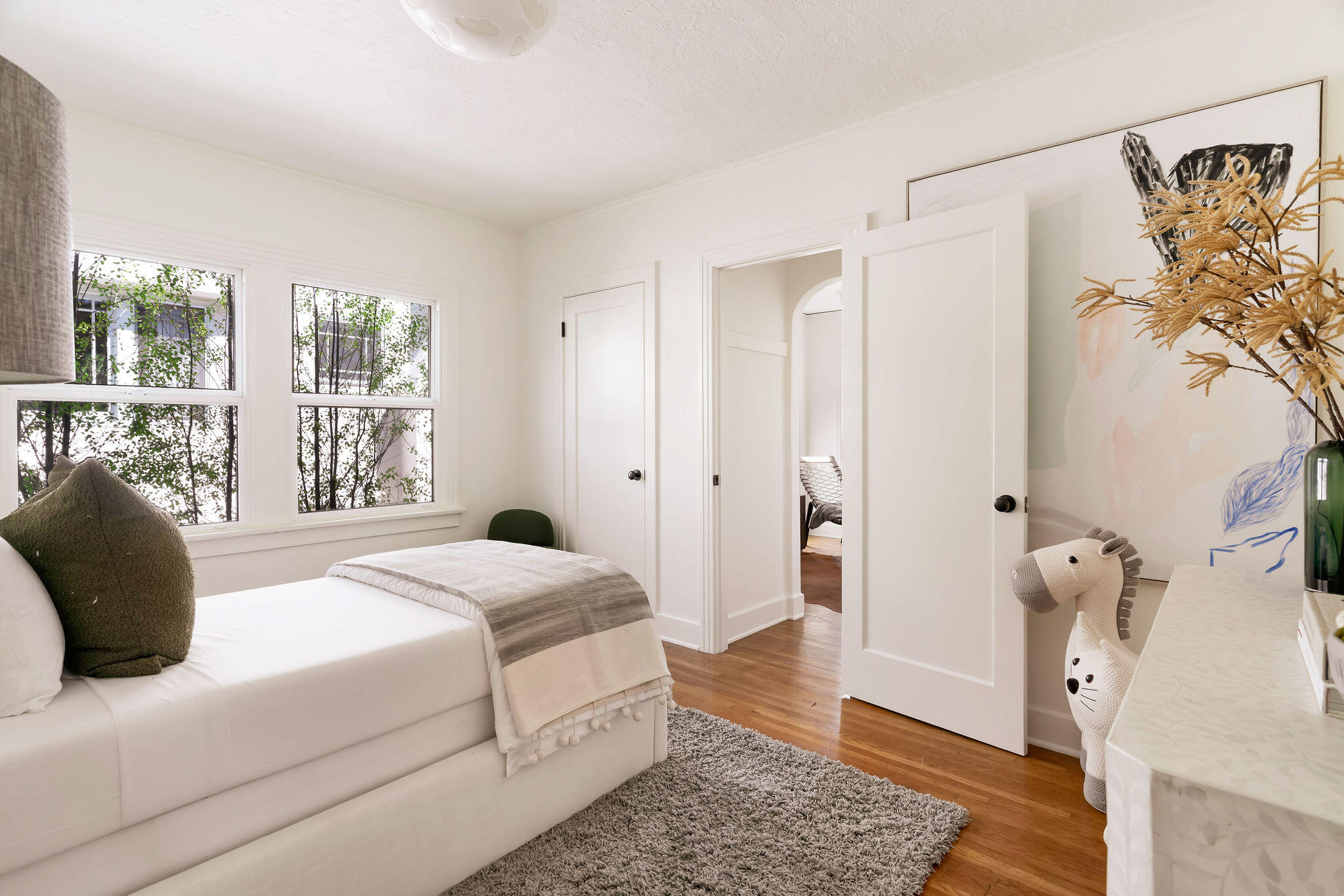 1317 Keniston Avenue Los Angeles, CA 90019 - Photo 24 of 57 a bedroom with a bed and a window