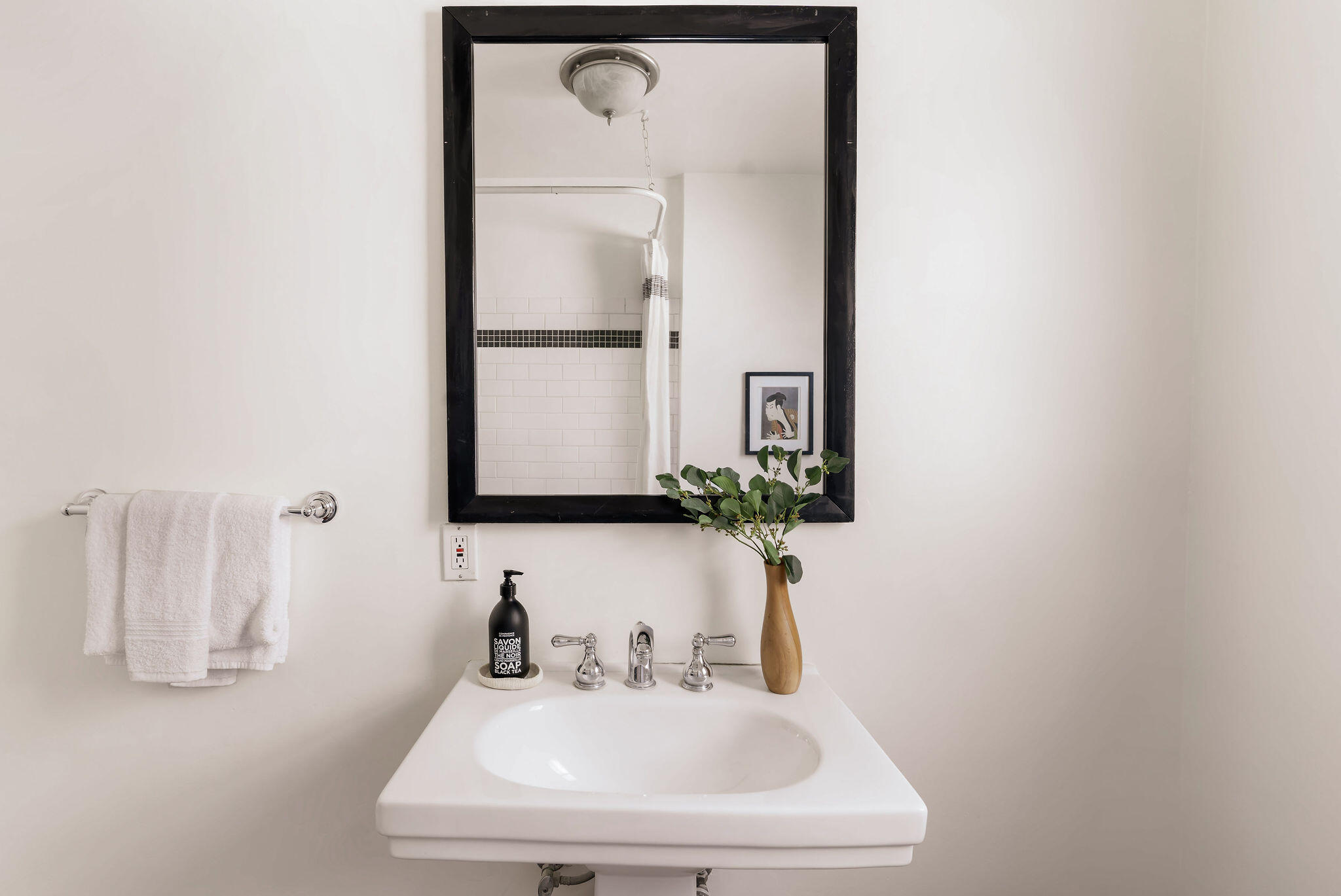 1317 Keniston Avenue Los Angeles, CA 90019 - Photo 27 of 57 a bathroom with a sink and a mirror