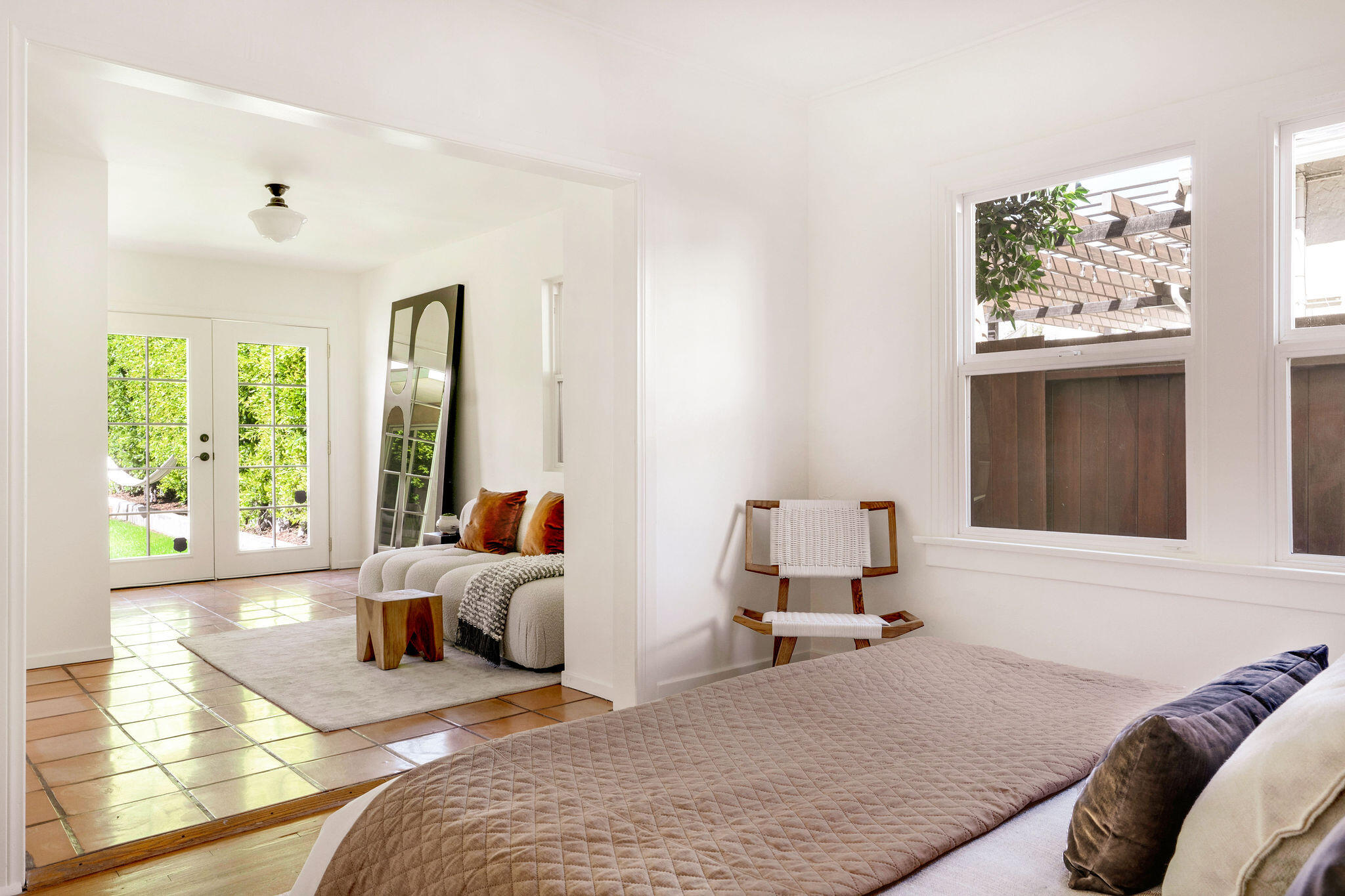 1317 Keniston Avenue Los Angeles, CA 90019 - Photo 29 of 57 a bedroom with furniture and a large window