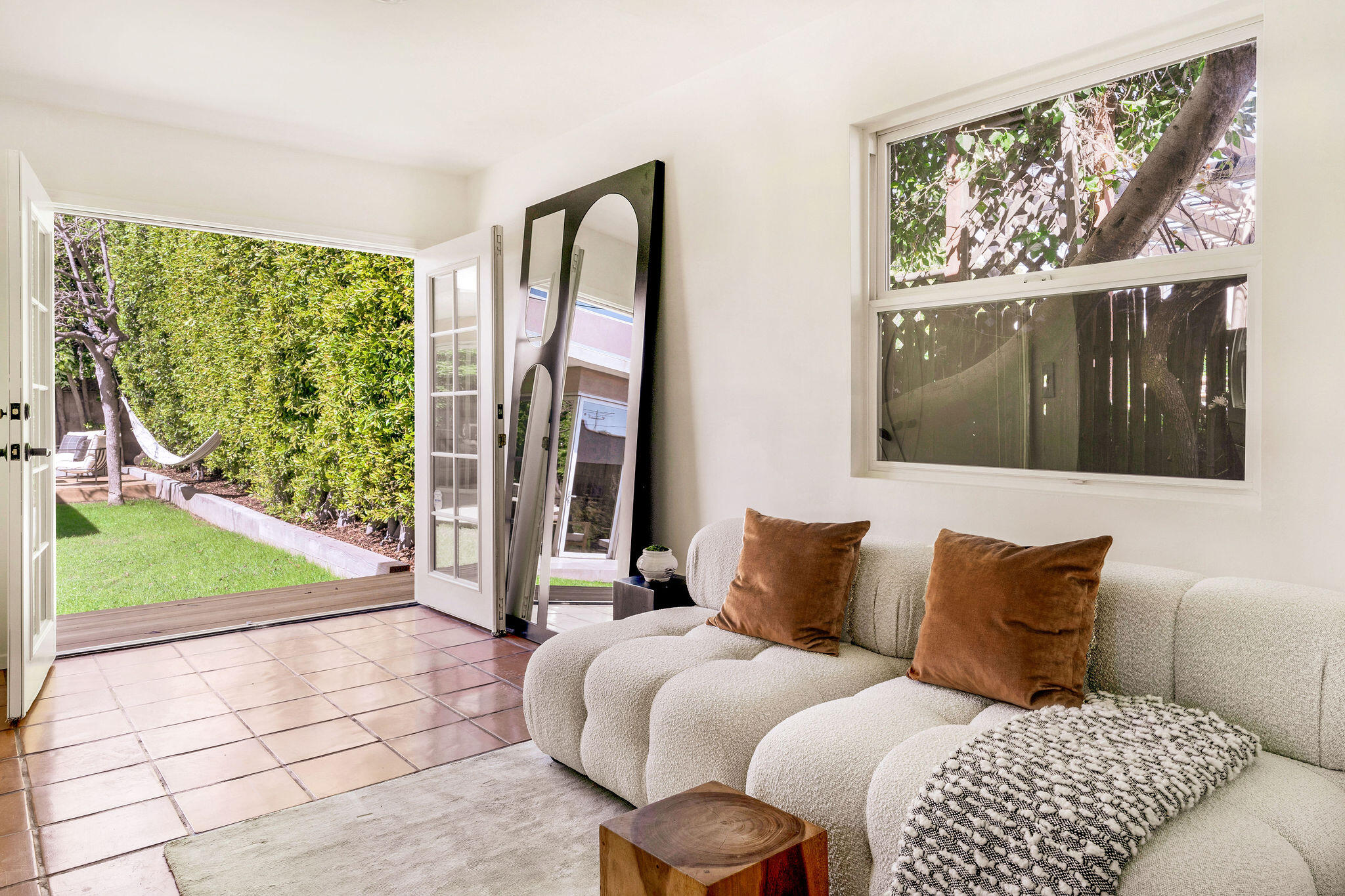 1317 Keniston Avenue Los Angeles, CA 90019 - Photo 30 of 57 a bedroom with a bed and a painting on the wall