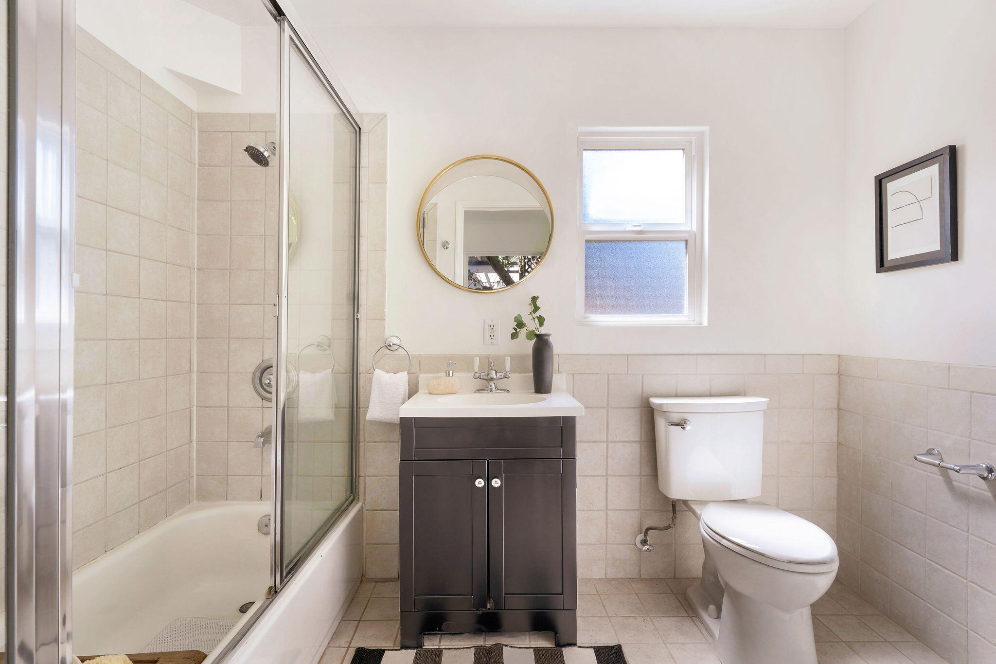 1317 Keniston Avenue Los Angeles, CA 90019 - Photo 32 of 57 a bathroom with a toilet sink shower and mirror