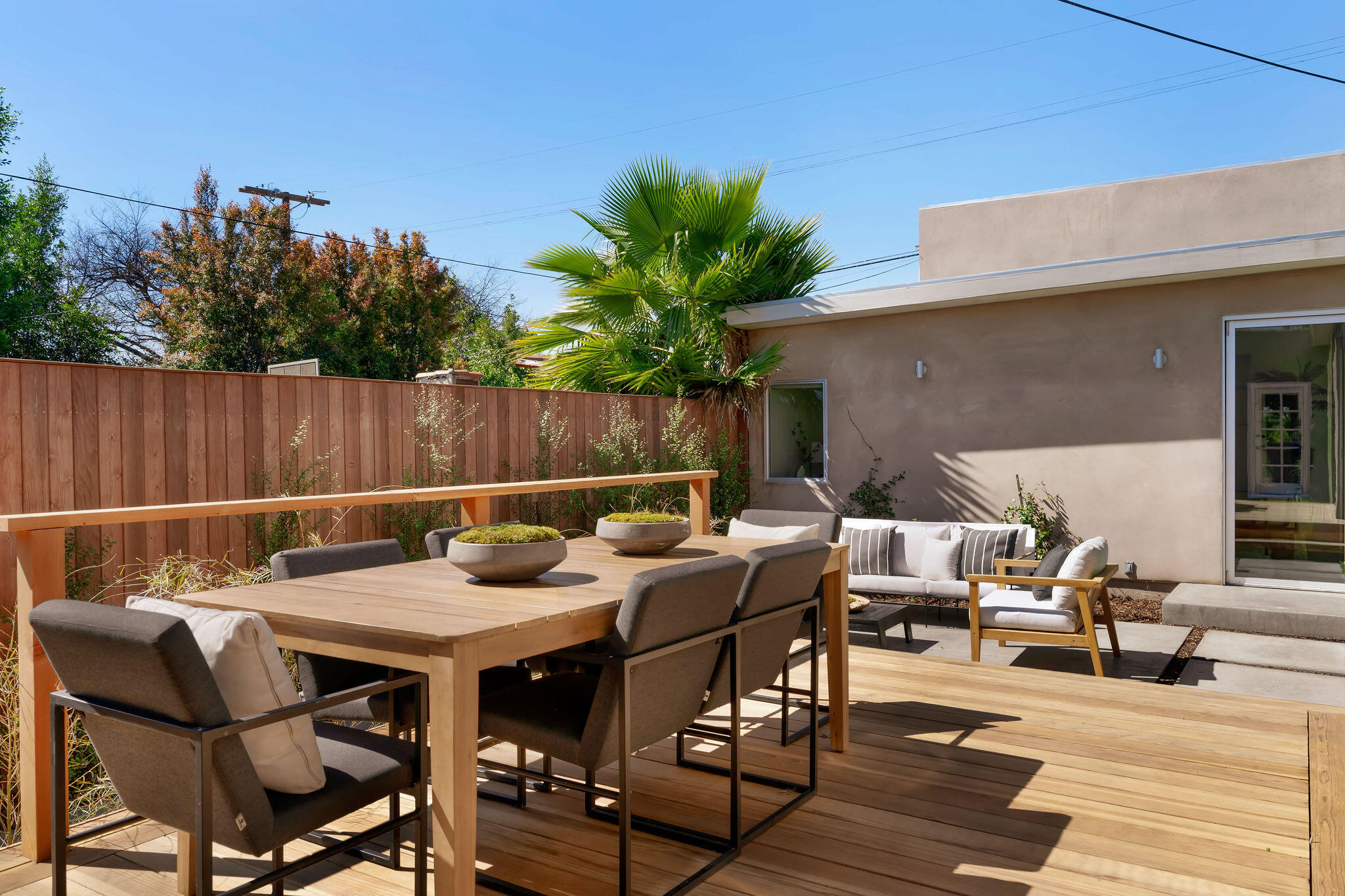 1317 Keniston Avenue Los Angeles, CA 90019 - Photo 37 of 57 a view of a dinning table and chairs in the patio
