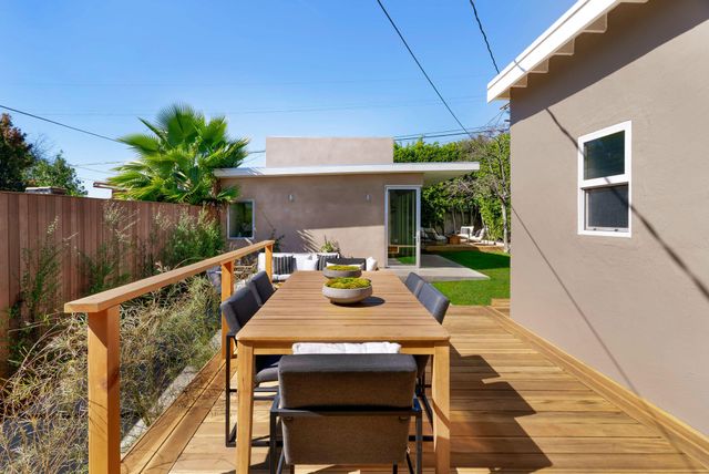 a view of a chair and table in the garden