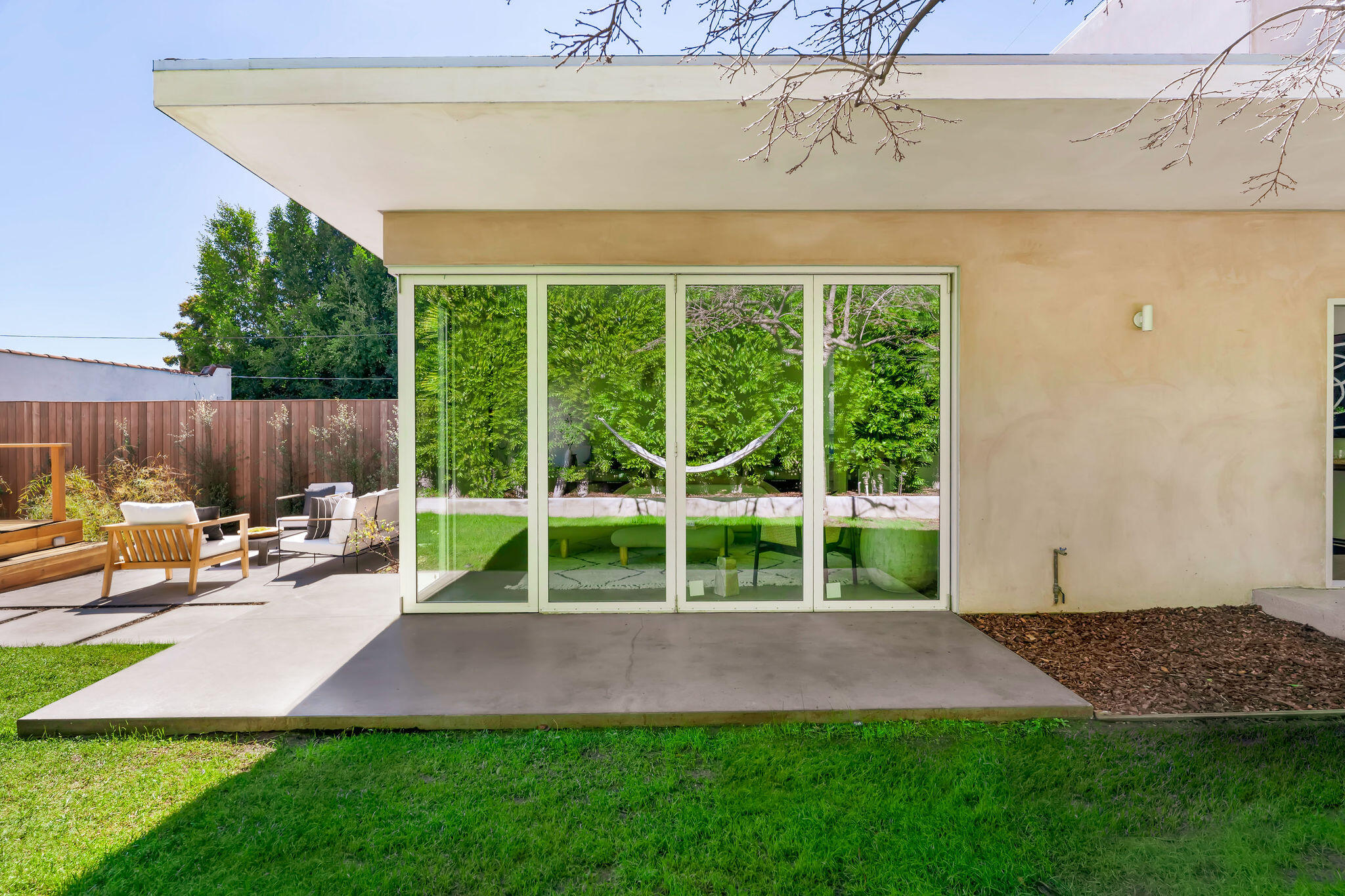 1317 Keniston Avenue Los Angeles, CA 90019 - Photo 40 of 57 a view of a chair and table in the garden