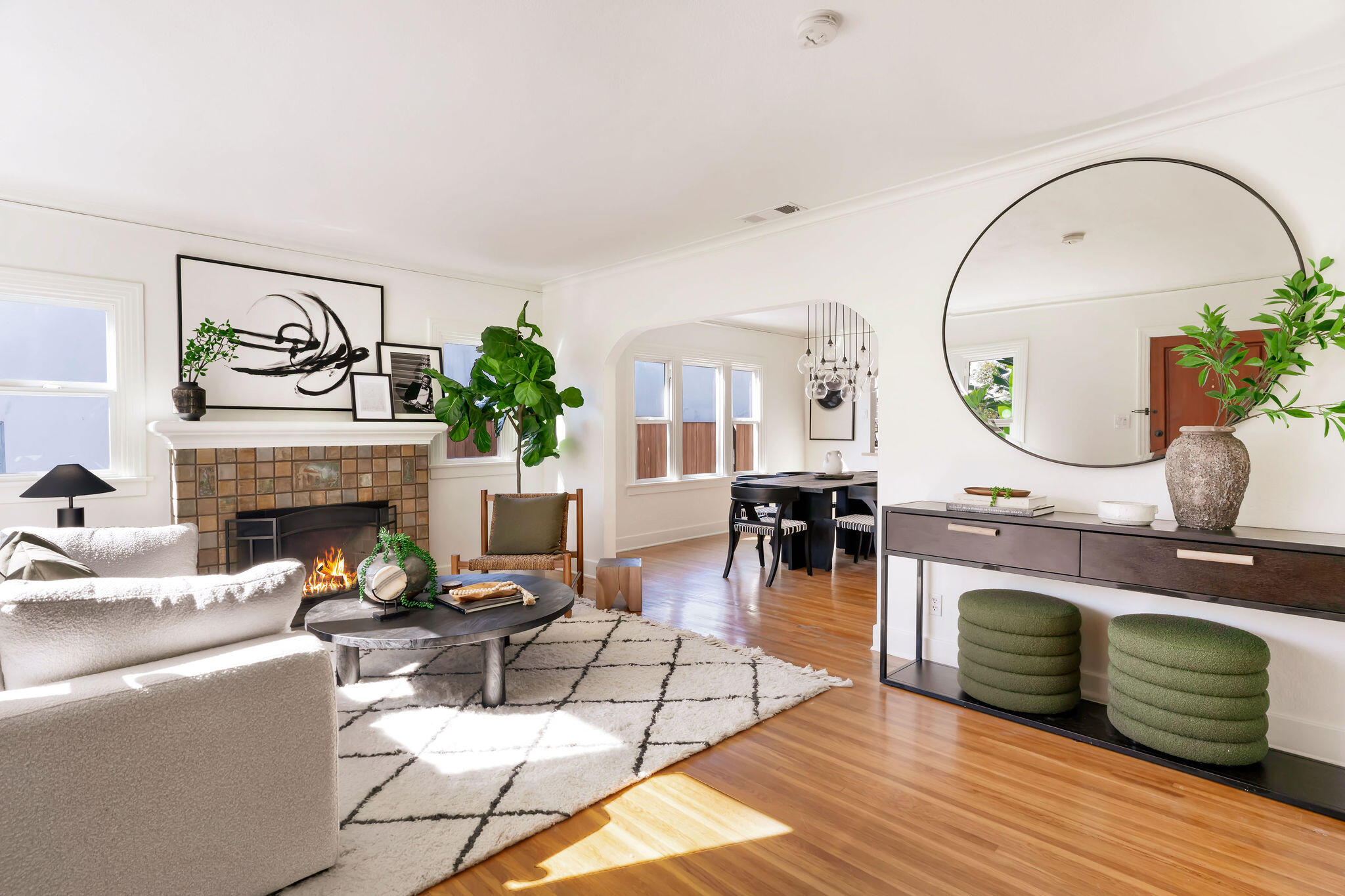 1317 Keniston Avenue Los Angeles, CA 90019 - Photo 4 of 57 a living room with furniture a fireplace and a potted plant