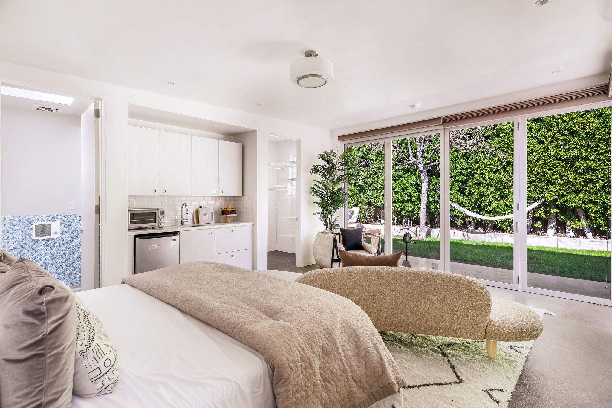 1317 Keniston Avenue Los Angeles, CA 90019 - Photo 42 of 57 a bedroom with a bed and a view of living room