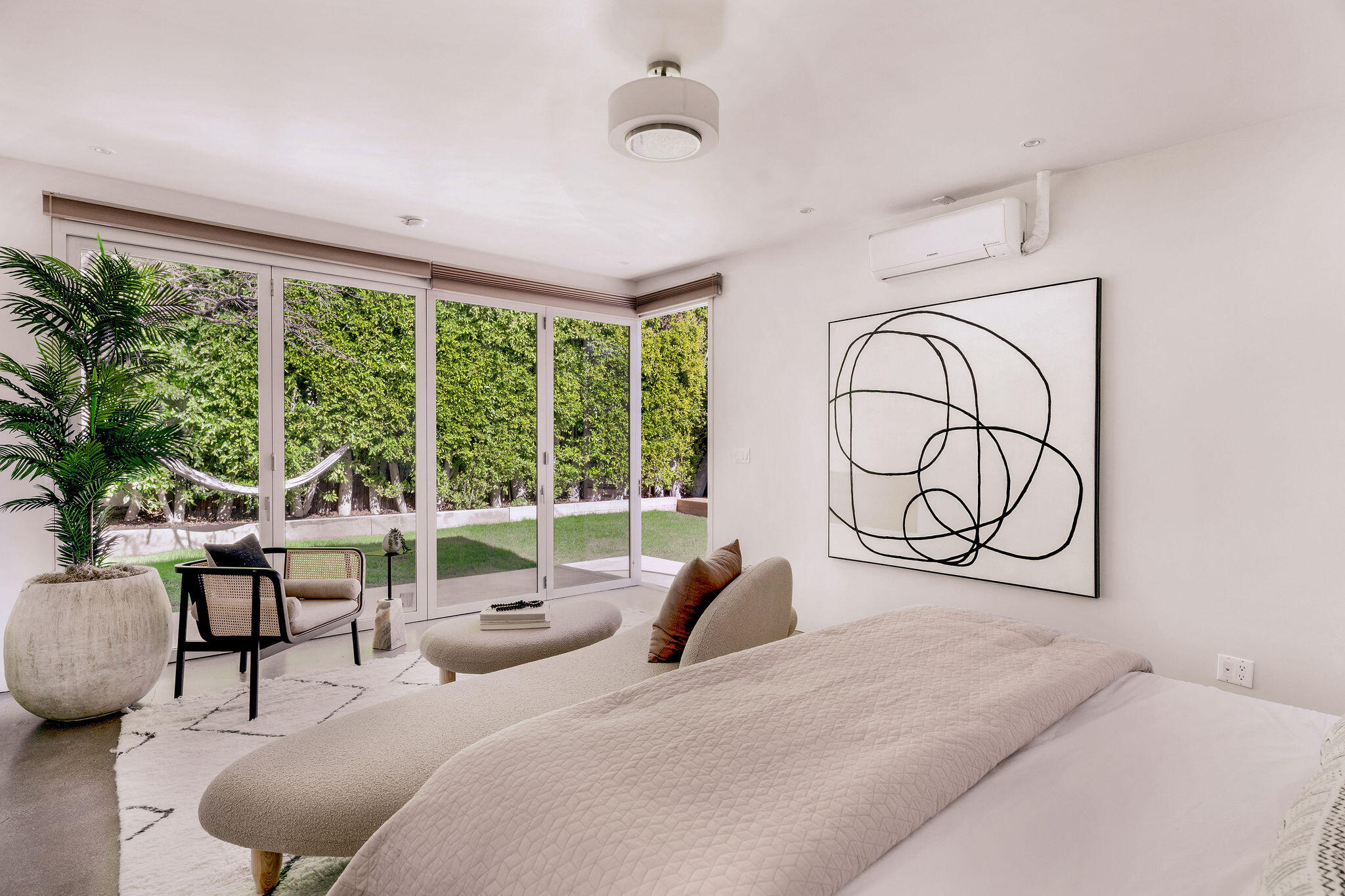 1317 Keniston Avenue Los Angeles, CA 90019 - Photo 43 of 57 a bedroom with furniture and a large window