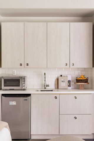 a view of a house with backyard and patio