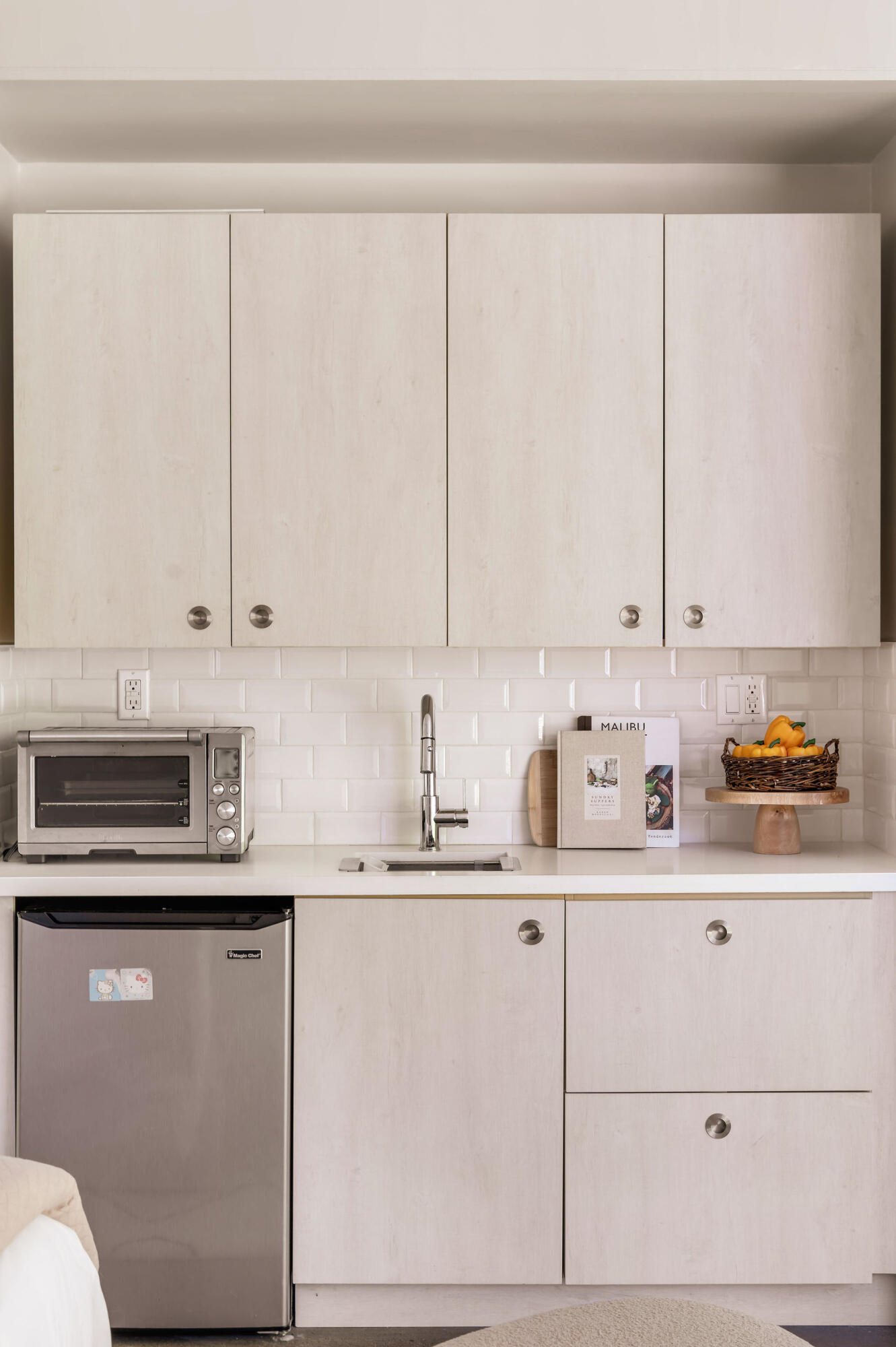 1317 Keniston Avenue Los Angeles, CA 90019 - Photo 45 of 57 a kitchen with stainless steel appliances granite countertop a sink a stove and cabinets