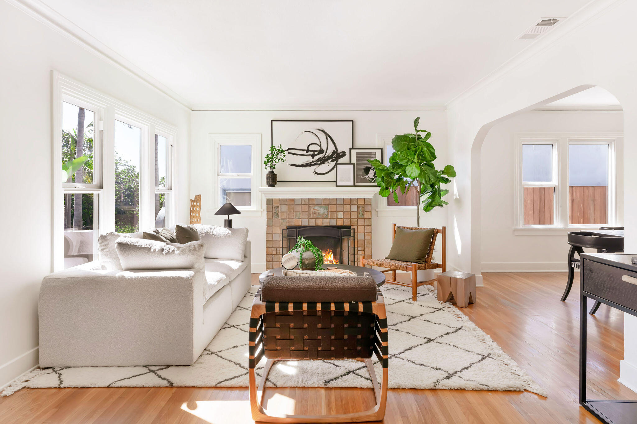 1317 Keniston Avenue Los Angeles, CA 90019 - Photo 6 of 57 a living room with furniture a fireplace and a table