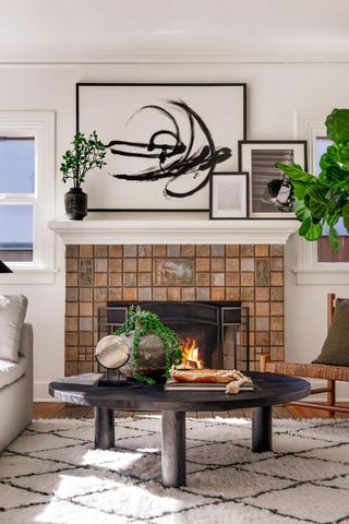 a living room with furniture a mirror and a table