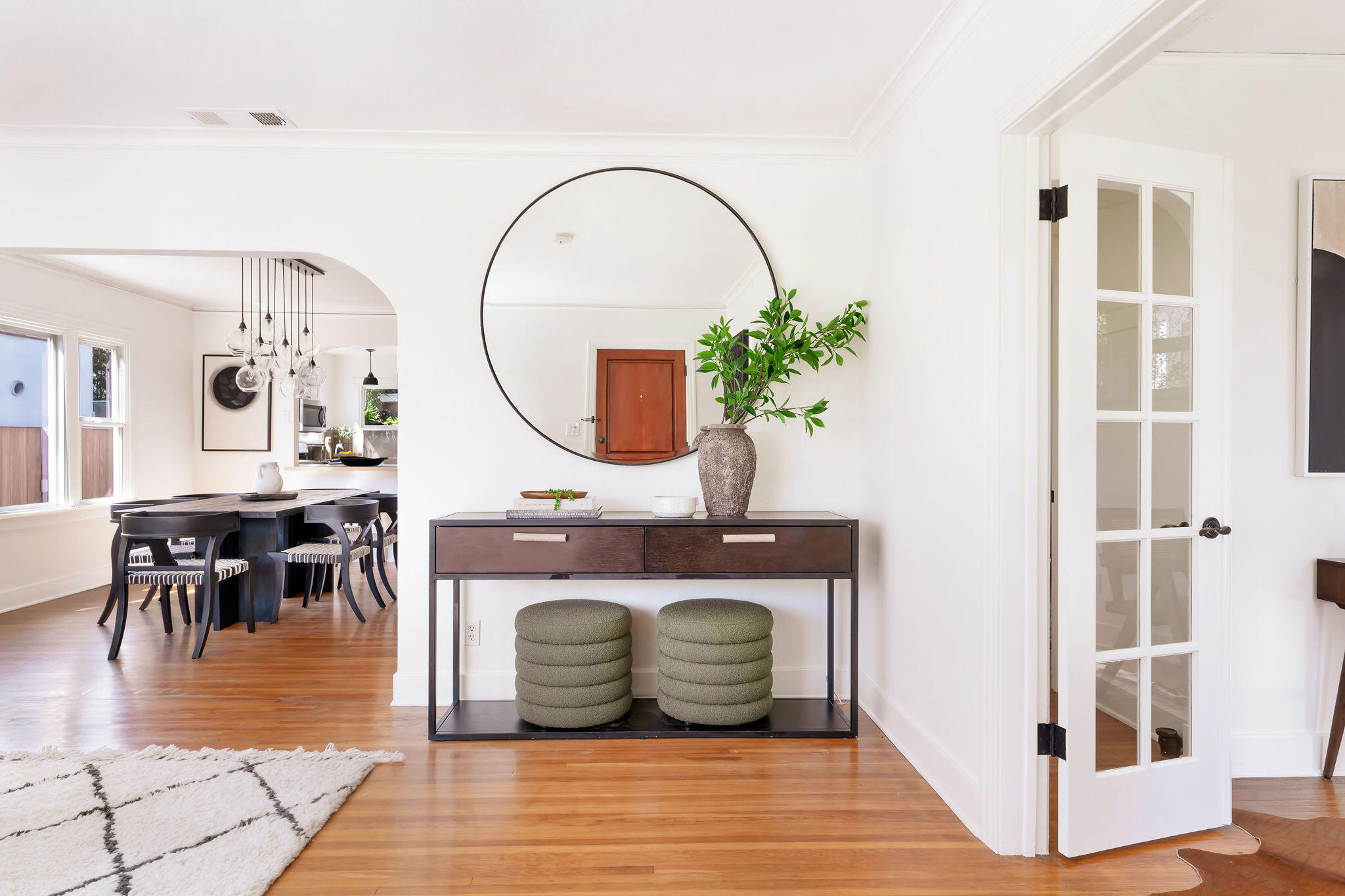1317 Keniston Avenue Los Angeles, CA 90019 - Photo 10 of 57 a living room with furniture a mirror and a table