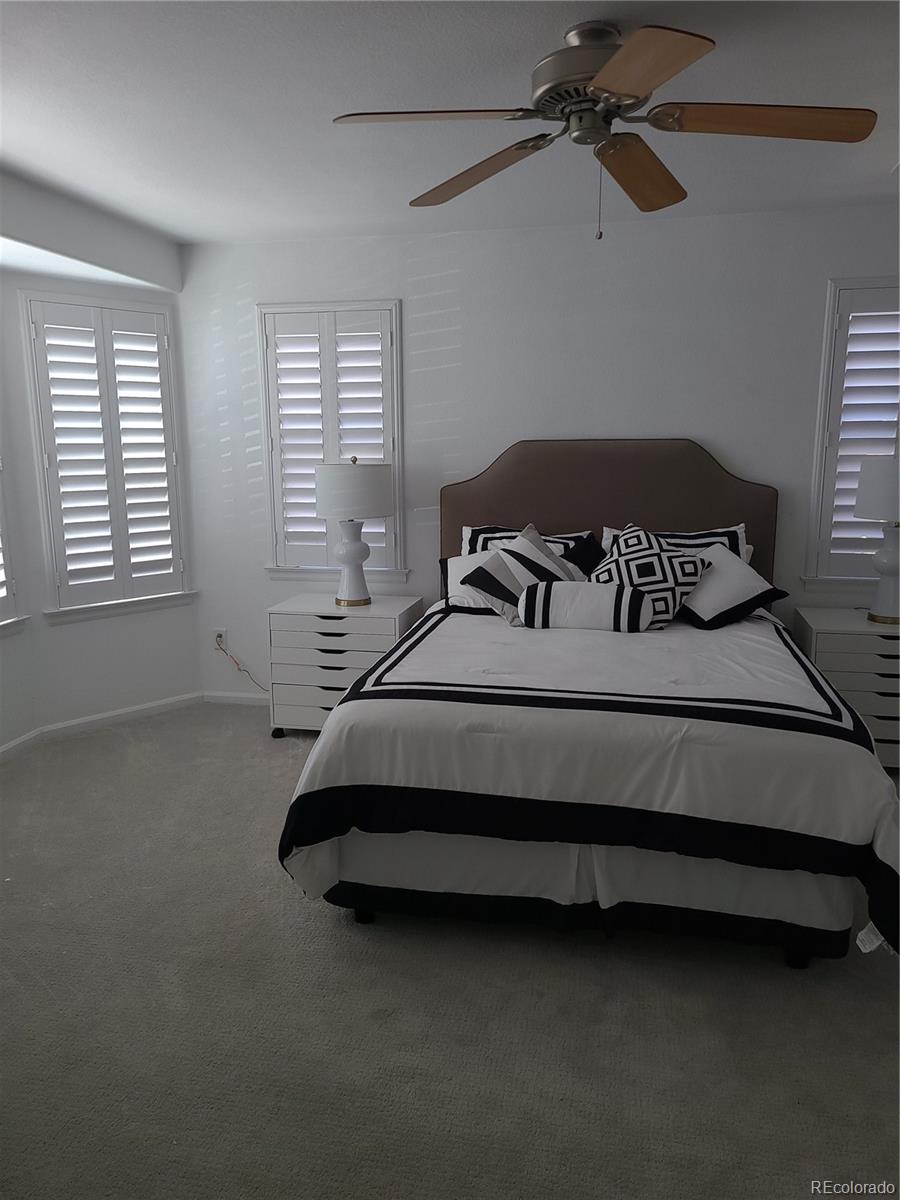 9492 Cedarhurst Lane, Unit B Highlands Ranch, CO 80129 - Photo 11 of 17 a bedroom with a bed and window