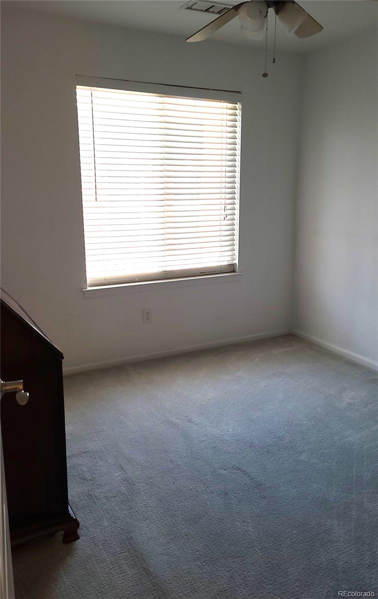 9492 Cedarhurst Lane, Unit B Highlands Ranch, CO 80129 - Photo 15 of 17 an empty room with a window