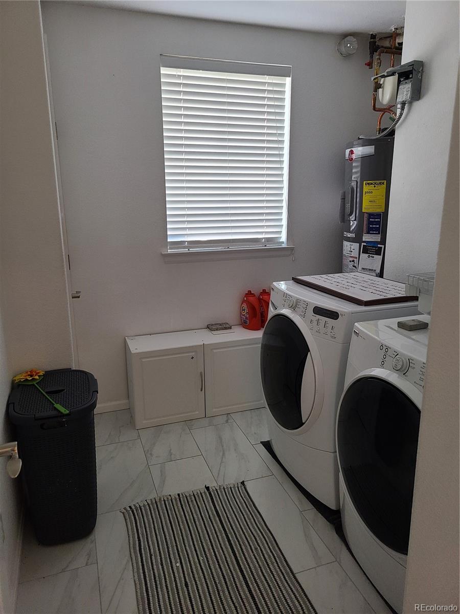 9492 Cedarhurst Lane, Unit B Highlands Ranch, CO 80129 - Photo 8 of 17 a bathroom with a sink a toilet and a mirror