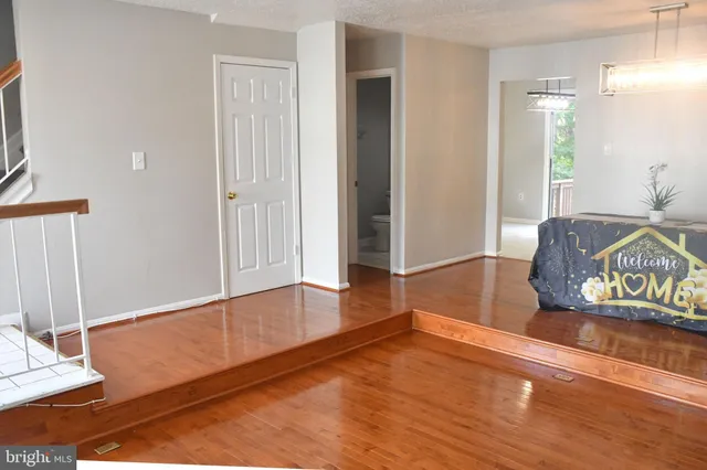 a view of living room with wooden floor
