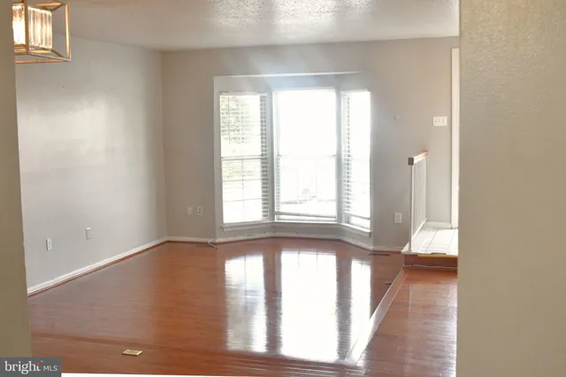 a kitchen with stainless steel appliances granite countertop a refrigerator stove top oven a sink and dishwasher