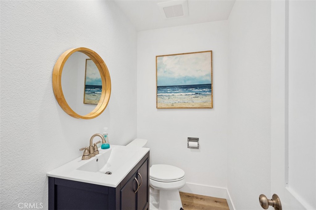 24562 Harbor View Drive, Unit 18 Dana Point, CA 92629 - Photo 12 of 33 a bathroom with a sink mirror and toilet
