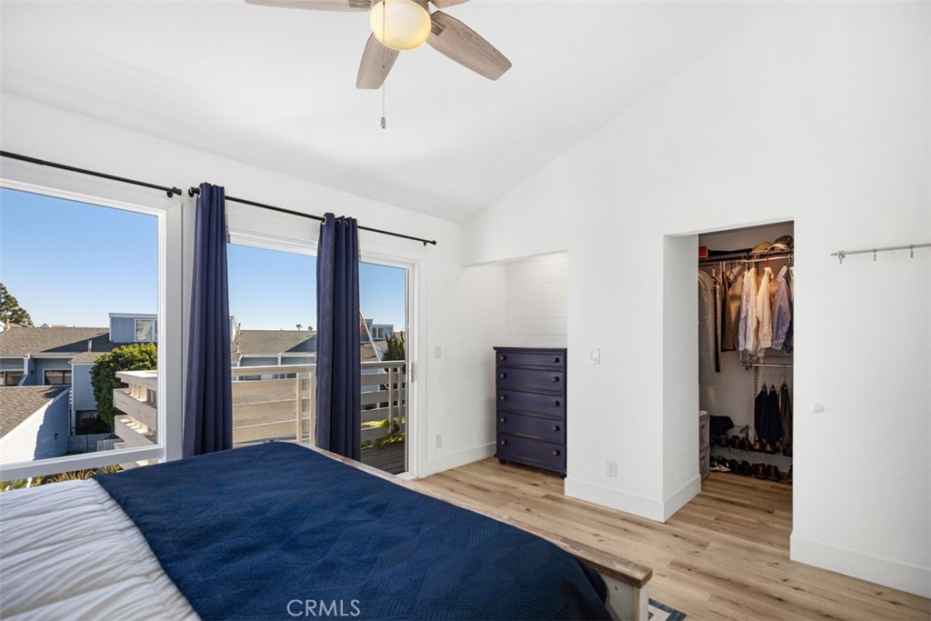24562 Harbor View Drive, Unit 18 Dana Point, CA 92629 - Photo 20 of 33 a bedroom with a bed and a walk in closet
