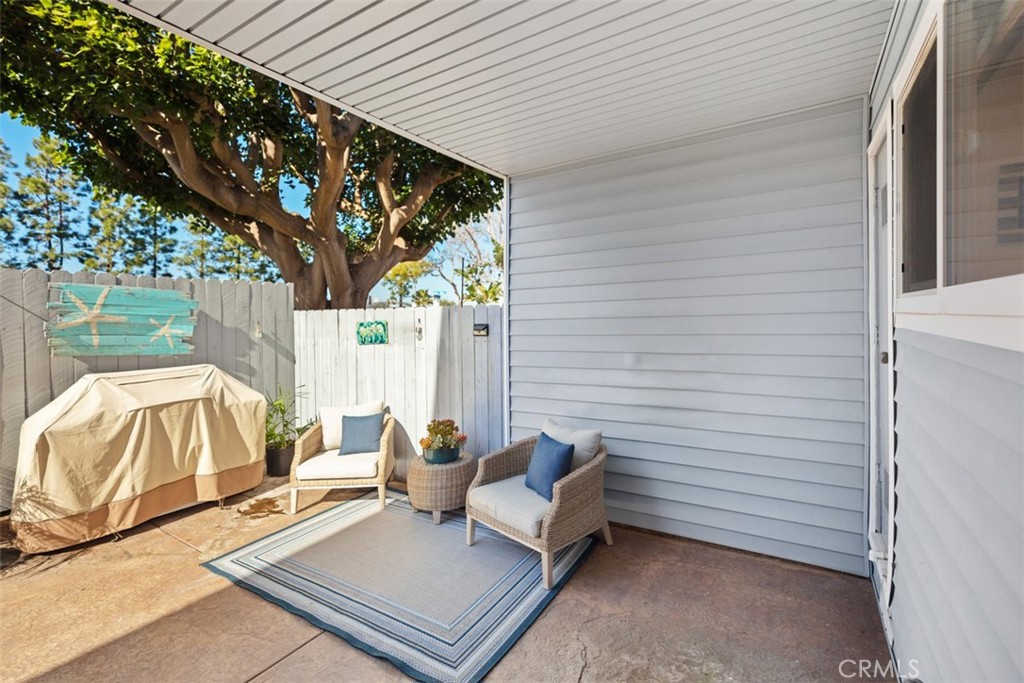 24562 Harbor View Drive, Unit 18 Dana Point, CA 92629 - Photo 22 of 33 a backyard of a house with seating space