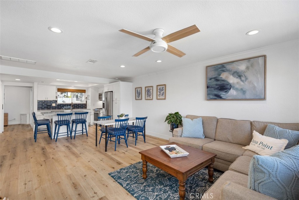 24562 Harbor View Drive, Unit 18 Dana Point, CA 92629 - Photo 7 of 33 a living room with furniture and wooden floor