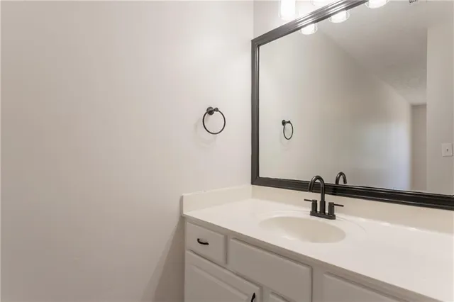 a bathroom with a sink and mirror