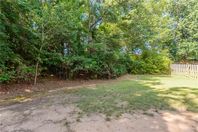 a view of a yard with a tree