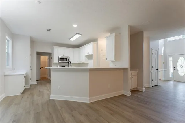 a view of kitchen with wooden floor