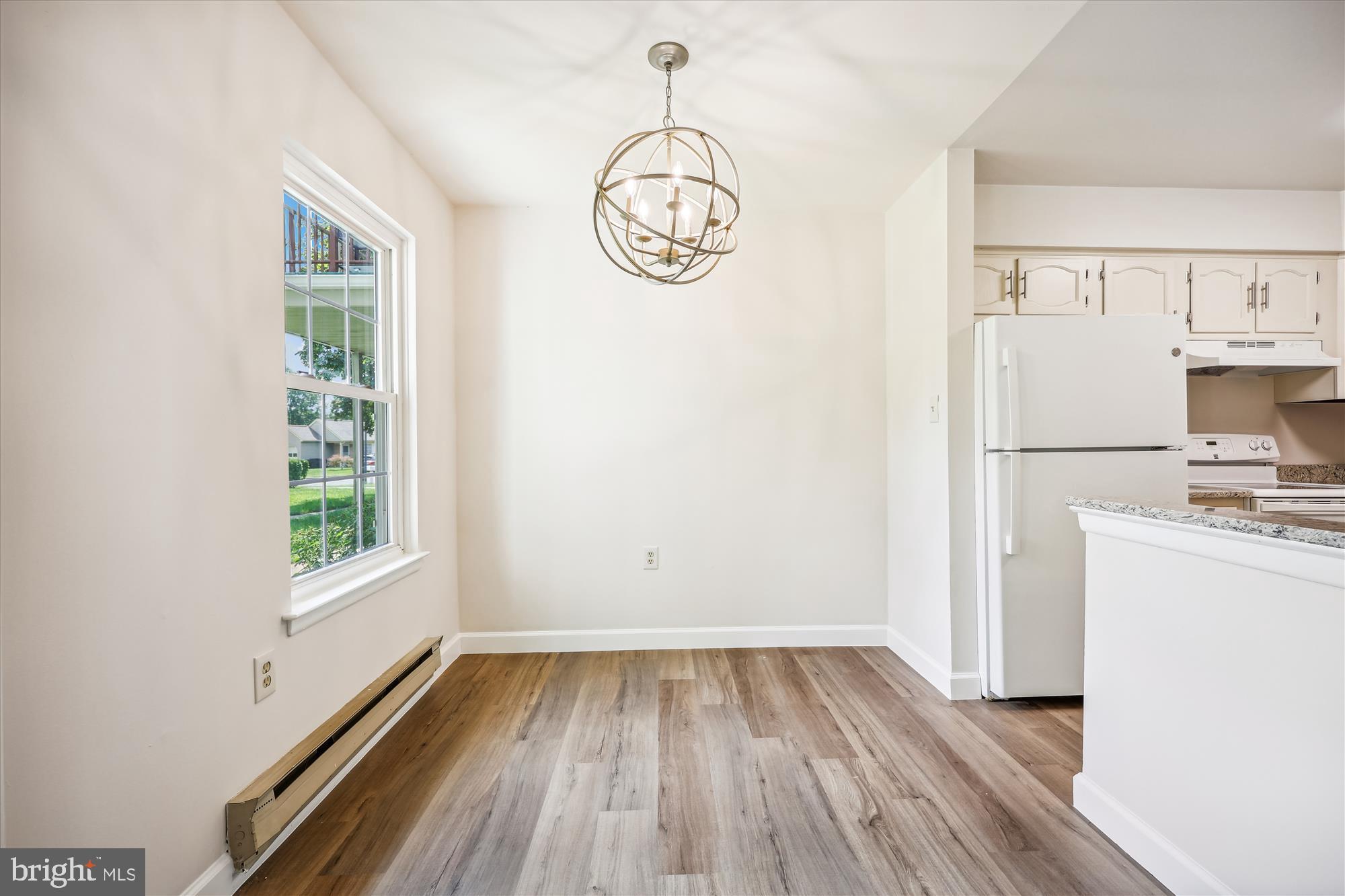 7040 Basswood Road, Unit 11 Frederick, MD 21703 - Photo 11 of 41 Dining Area with New LVP Flooring
