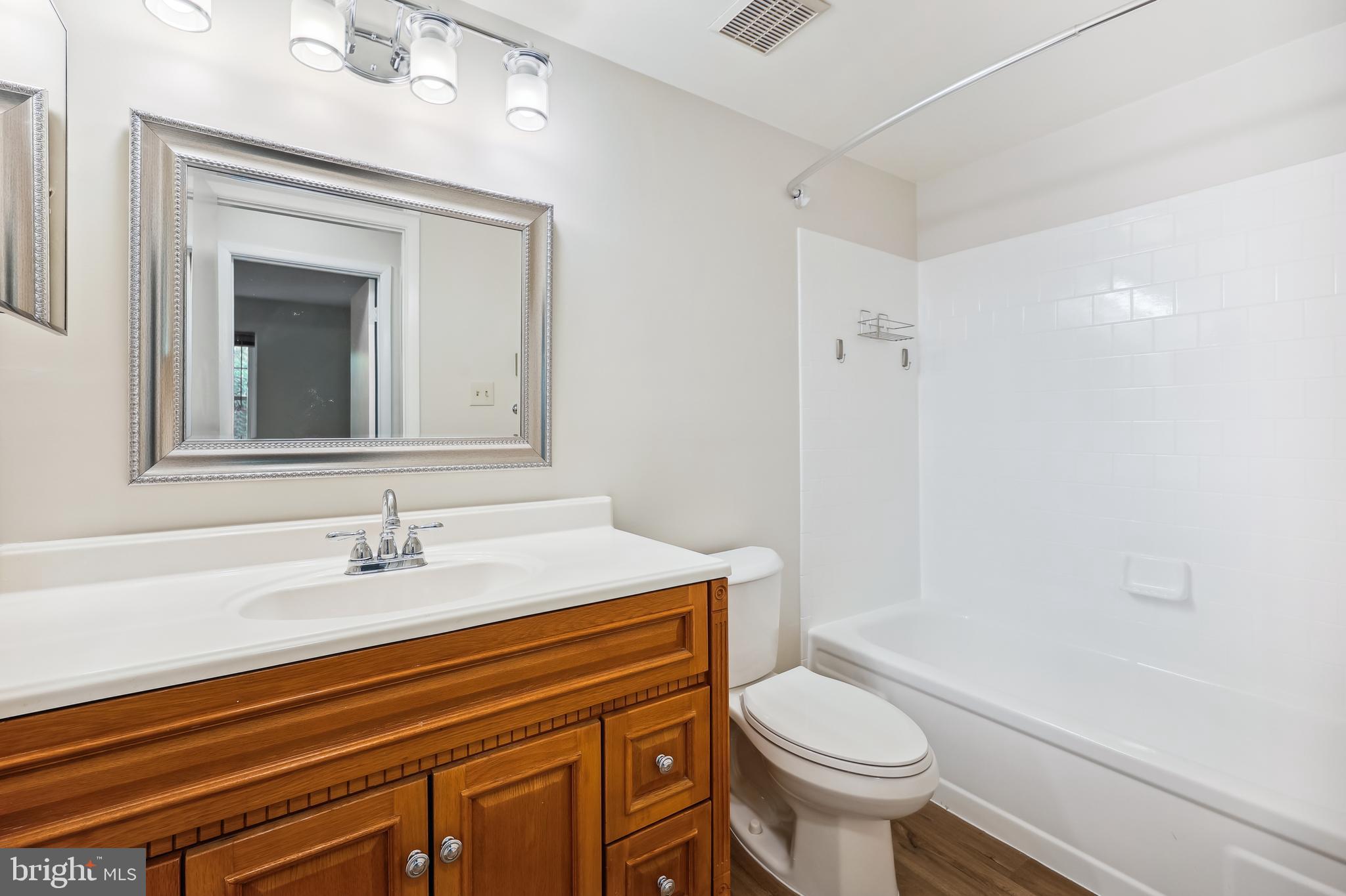 7040 Basswood Road, Unit 11 Frederick, MD 21703 - Photo 29 of 41 Remodeled full bath with c tile tub surround