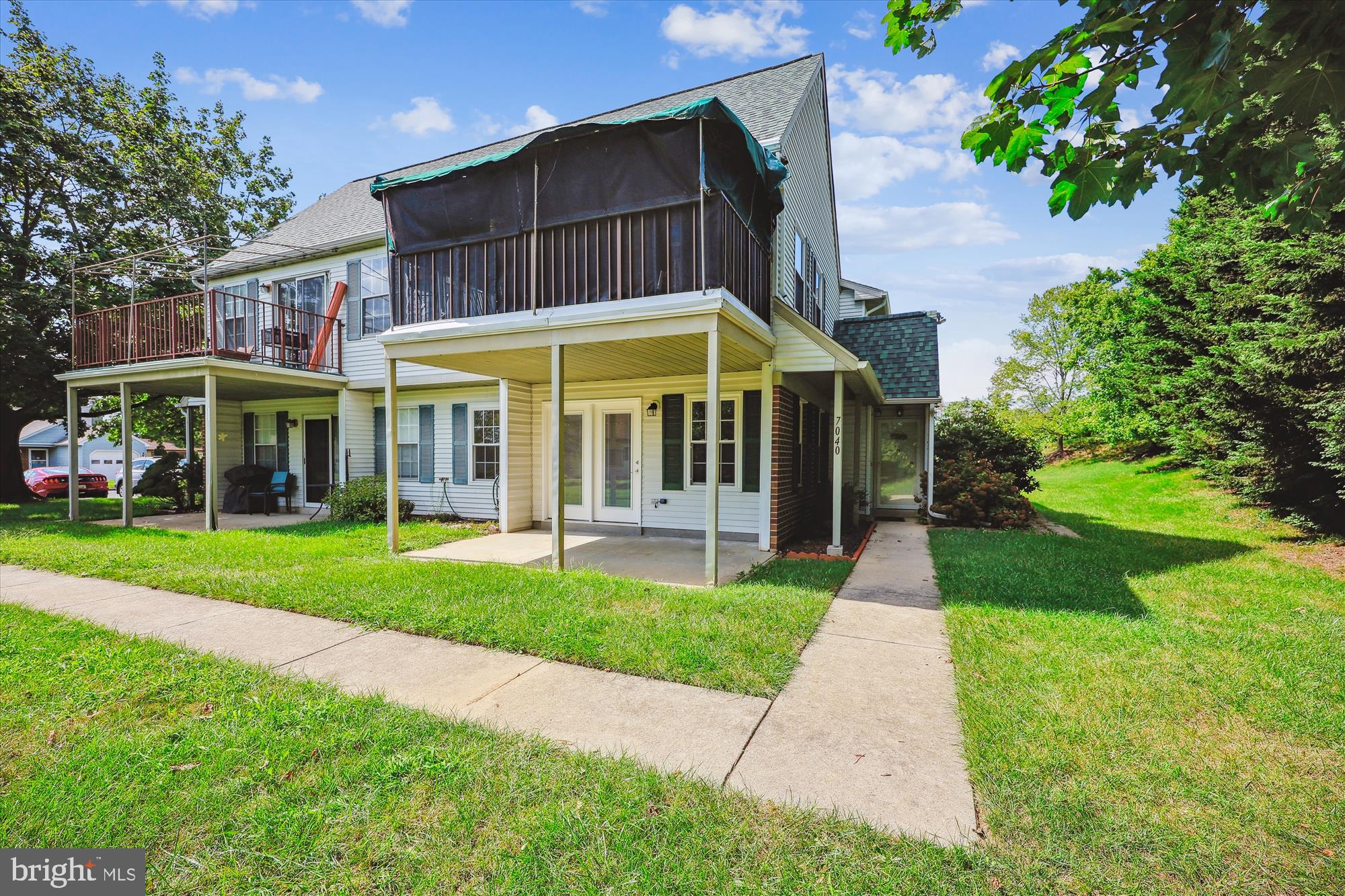 7040 Basswood Road, Unit 11 Frederick, MD 21703 - Photo 4 of 41 Covered patio and walkway to side entrance