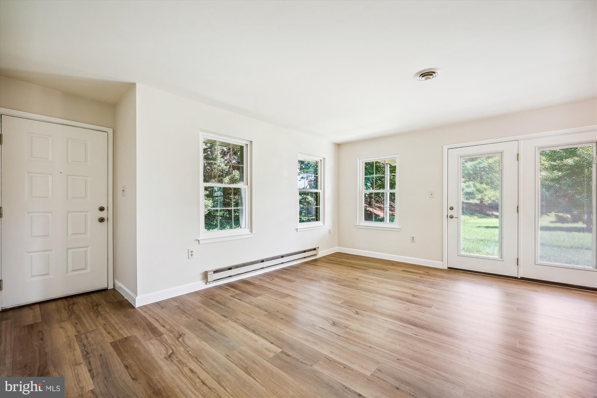 7040 Basswood Road, Unit 11 Frederick, MD 21703 - Photo 5 of 41 Foyer entrance and LR with double exposure