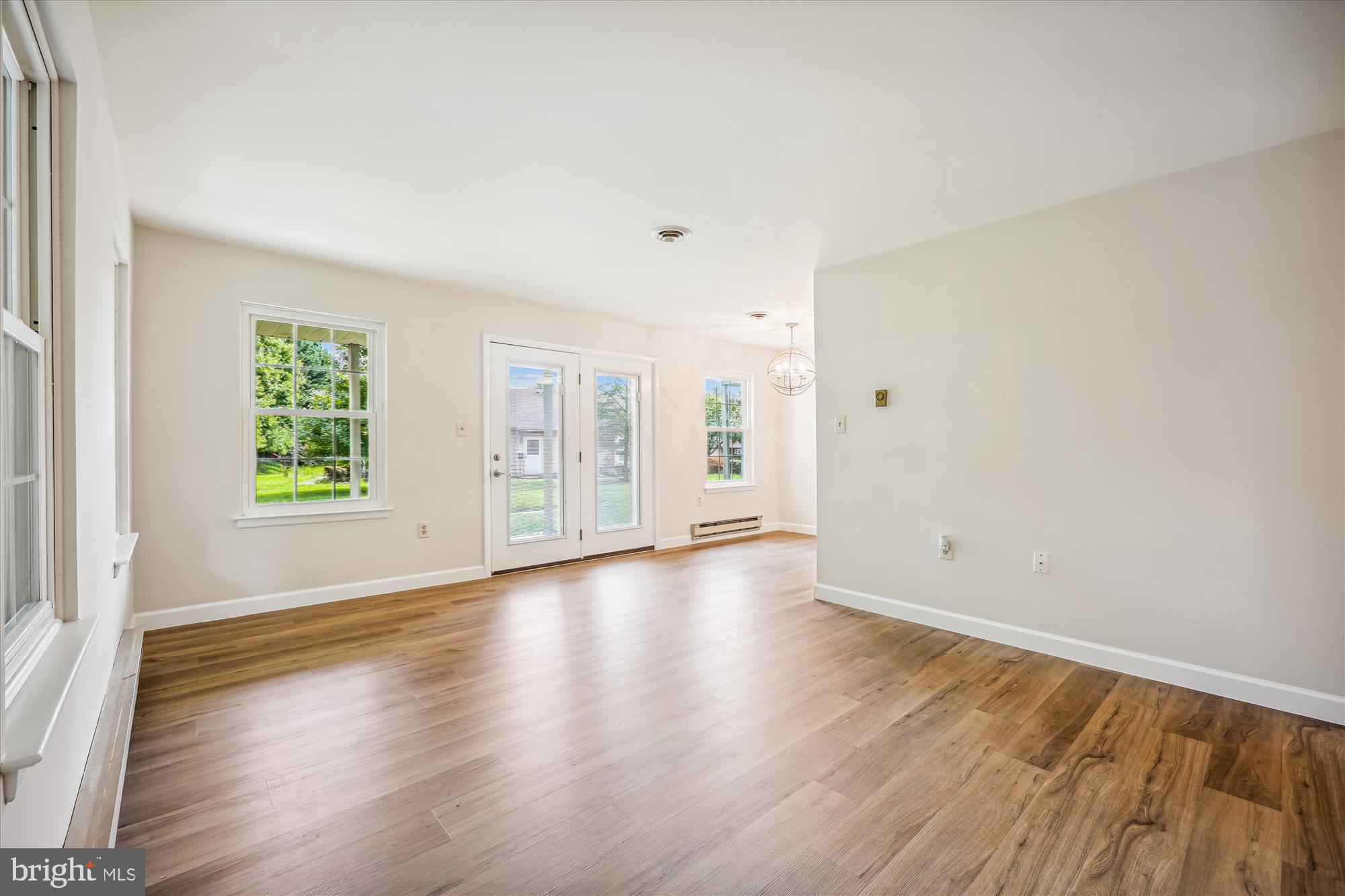 7040 Basswood Road, Unit 11 Frederick, MD 21703 - Photo 9 of 41 Living Room with French Door to covered patio