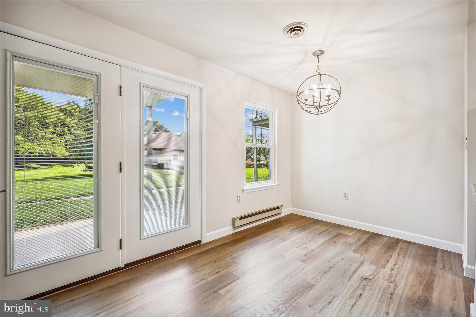 7040 Basswood Road, Unit 11 Frederick, MD 21703 - Photo 10 of 41 Dining Area with New Chandelier