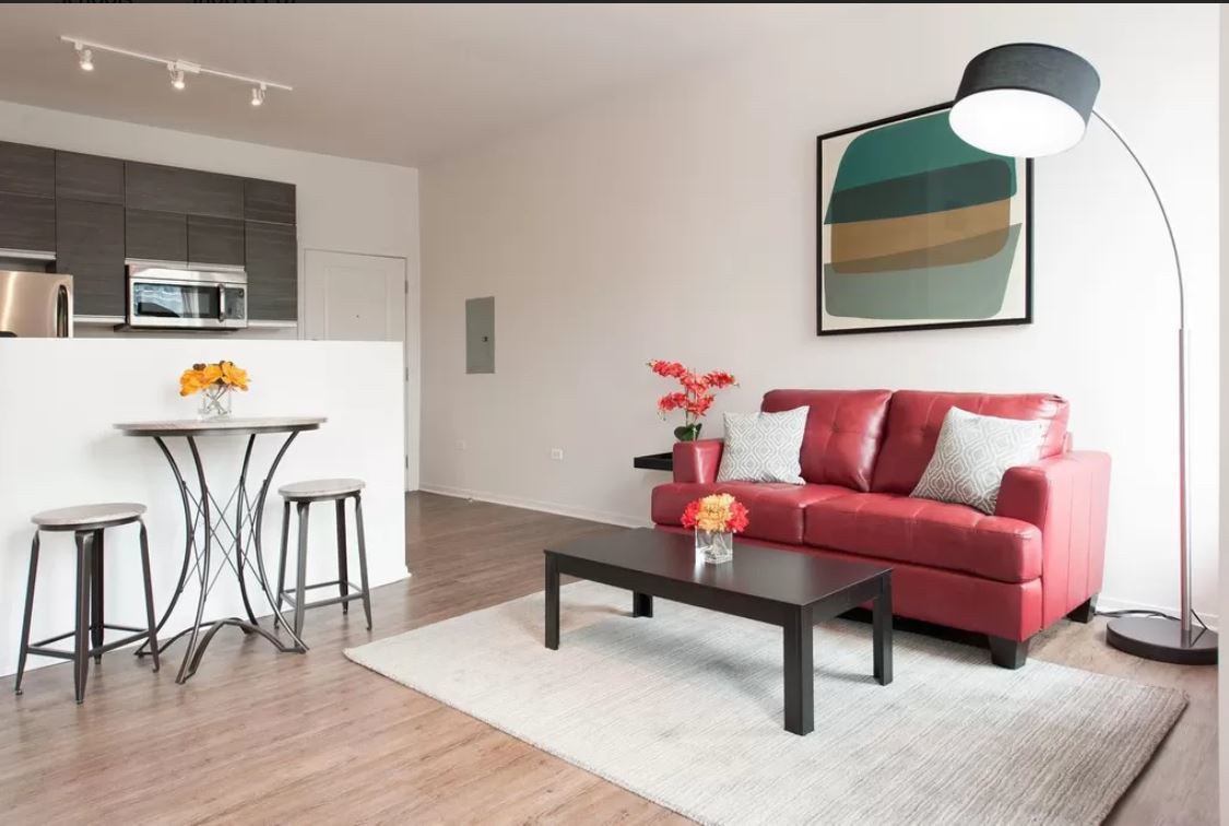 30 East Roosevelt Road, Unit 502 Chicago, IL 60605 - Photo 2 of 5 a living room with furniture and wooden floor