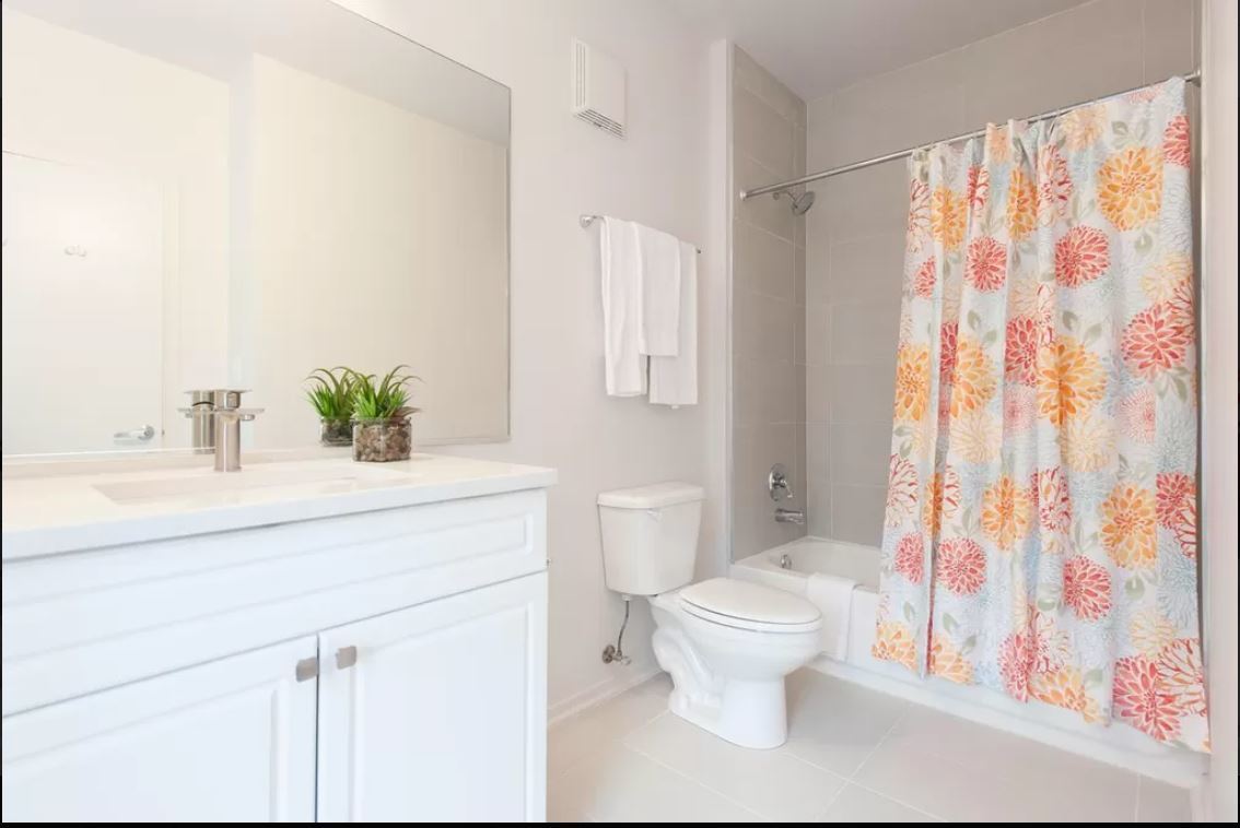 30 East Roosevelt Road, Unit 502 Chicago, IL 60605 - Photo 5 of 5 a bathroom with a sink a toilet and a shower