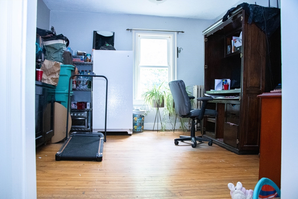85-87 Slater Street Webster, MA 01570 - Photo 36 of 41 a view of a workspace with furniture and a window