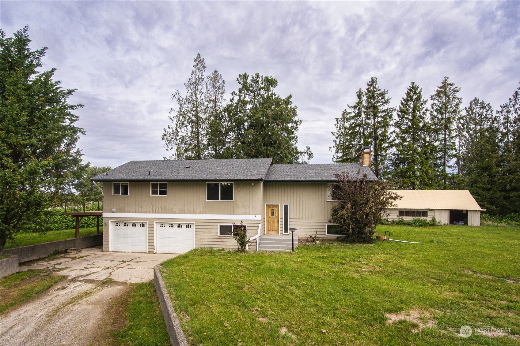8130 Gillies Road Everson, WA 98247 - Photo 1 of 39 a front view of a house with a yard and trees