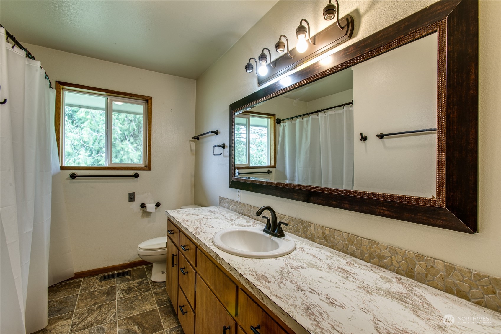 8130 Gillies Road Everson, WA 98247 - Photo 12 of 39 a bathroom with a granite countertop sink and a mirror
