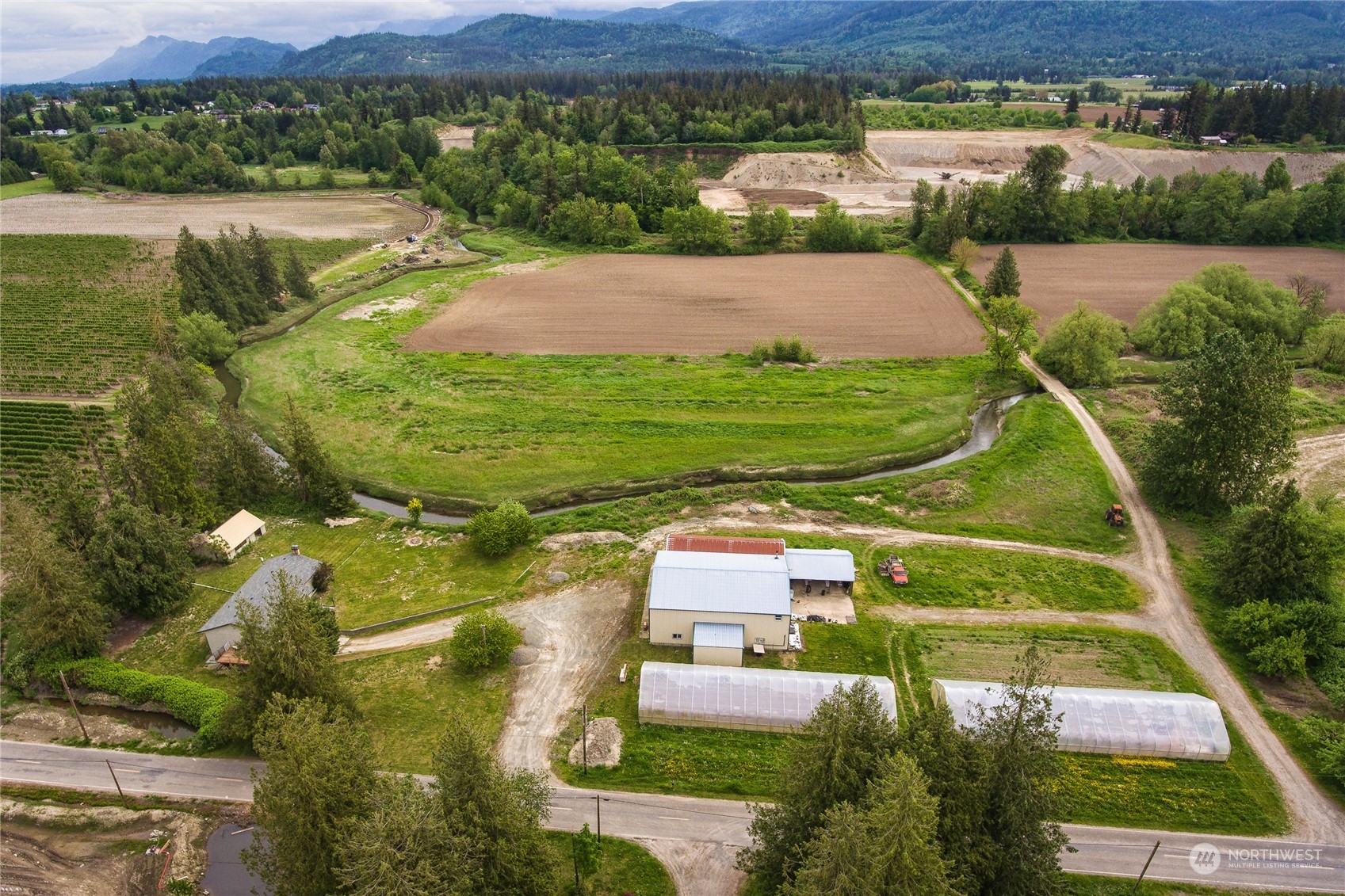8130 Gillies Road Everson, WA 98247 - Photo 35 of 39 an aerial view of a house with a lake view