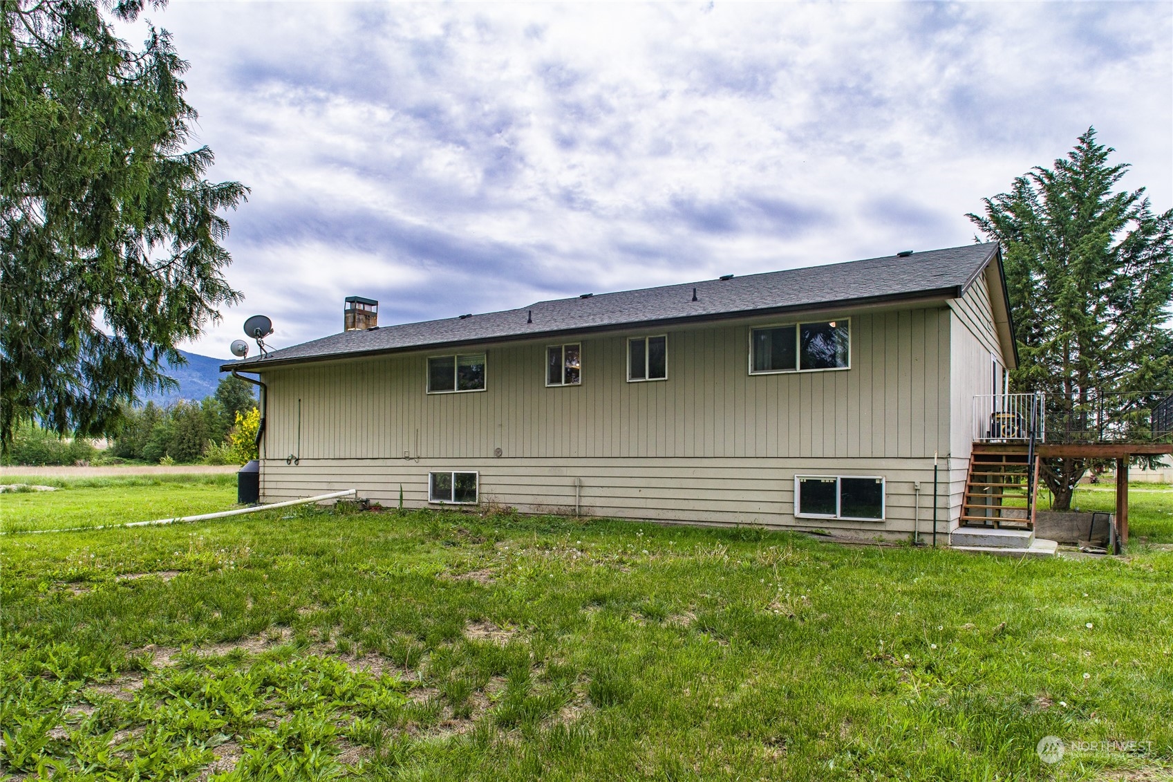 8130 Gillies Road Everson, WA 98247 - Photo 4 of 39 a backyard of a house with lots of green space