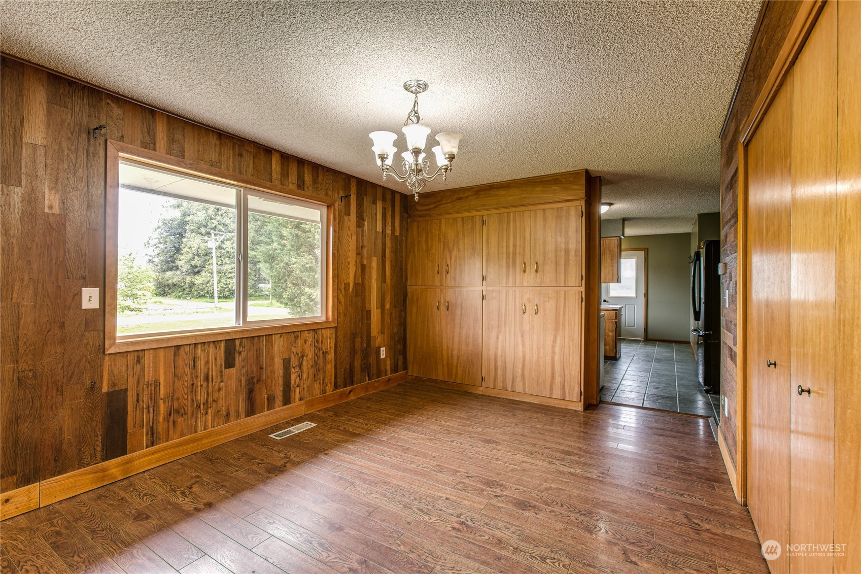 8130 Gillies Road Everson, WA 98247 - Photo 9 of 39 a view of a livingroom with wooden floor and a large window