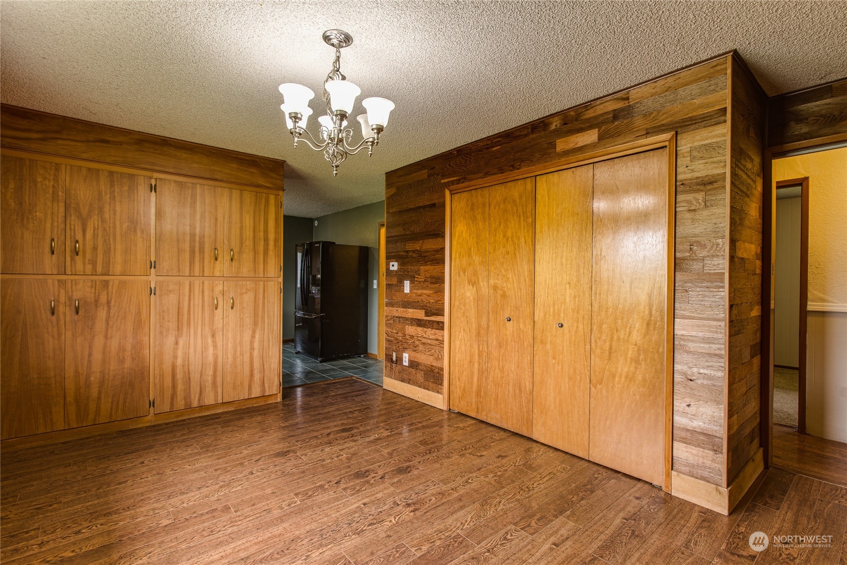 8130 Gillies Road Everson, WA 98247 - Photo 10 of 39 a view of a hallway with wooden shelves