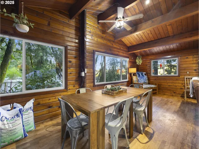 a view of a dining room with furniture window and outside view