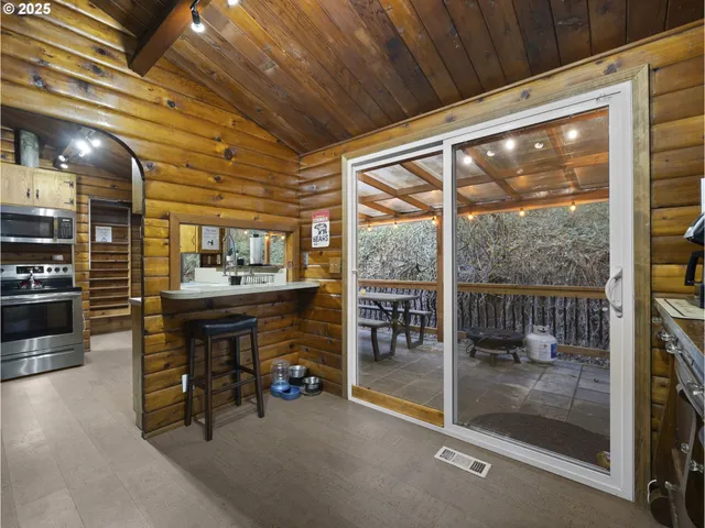 a room with lots of furniture and a large window